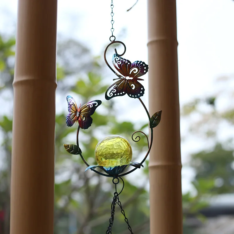 

The courtyard is decorated with solar lamps, wind chimes hanging iron glowing landscape decoration