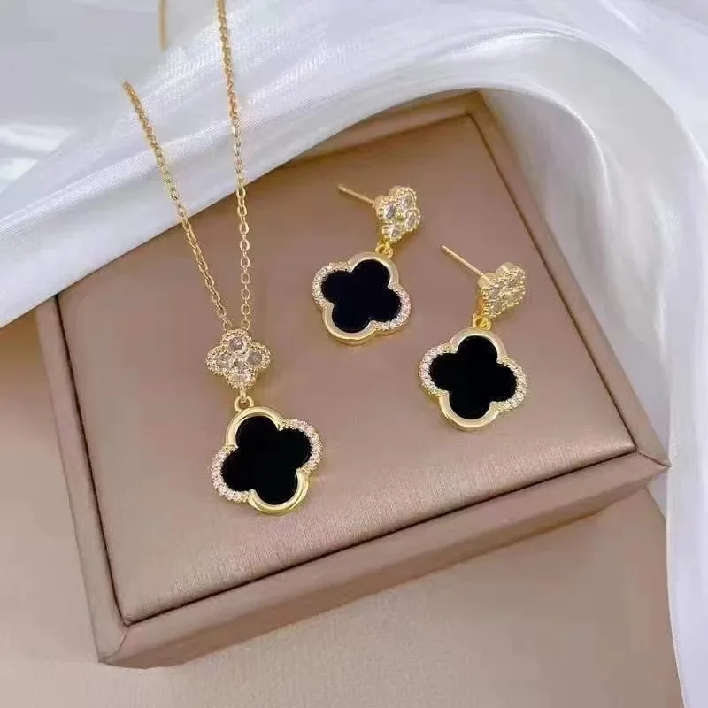

2025 High-end niche Slightly inlaid clover necklace earrings set, light luxury, individual and elegant earrings and necklaces