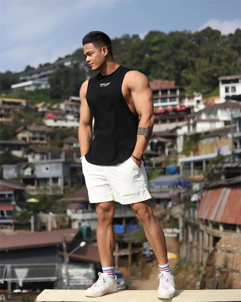 Camiseta deportiva sin mangas con dobladillo curvo para hombre, ropa informal de entrenamiento para gimnasio, chaleco de culturismo, camisetas de Fitness musculosas