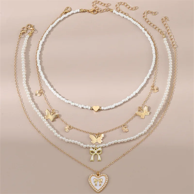4pcs/set Kids Everyday White Bead Set – Butterfly & Heart Pendants on Stackable Strands for Effortless, Adorable Style.