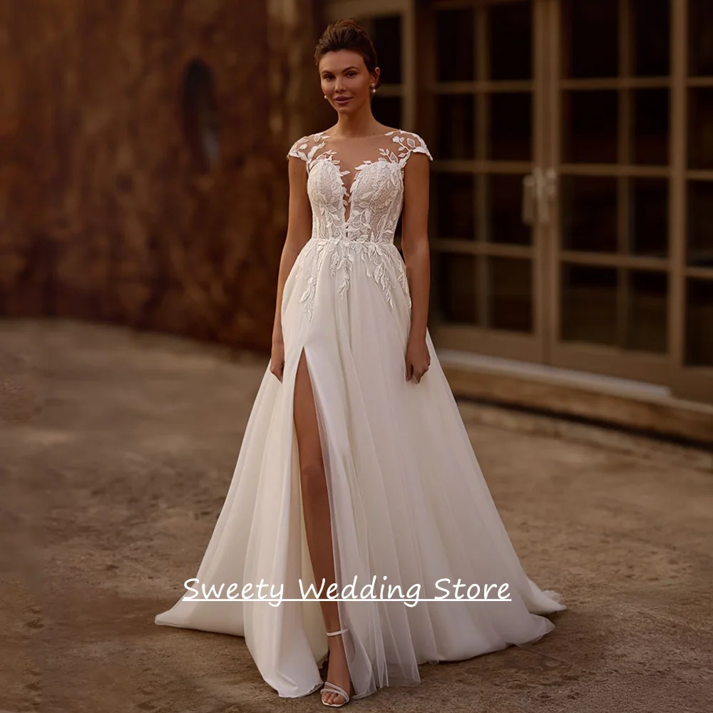 

Cheap Wedding Dress for Bride Customized Cap Sleeve Round Neck See Through Lace Applique Slit Soft Tulle A Line Bridal Gown
