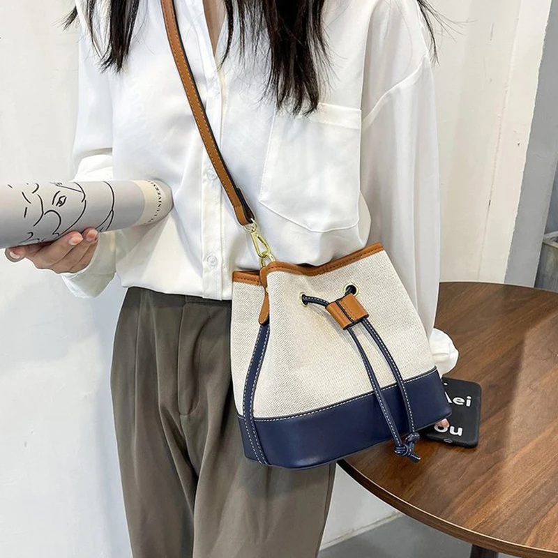 New canvas contrast color portable bucket bag Street trend texture drawstring One Shoulder Messenger canvas bag