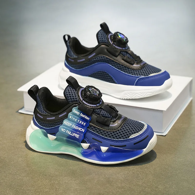 

A pair of children's sports shoes, with a durable sole and a rotating button design for a casual styleTL-2301-2