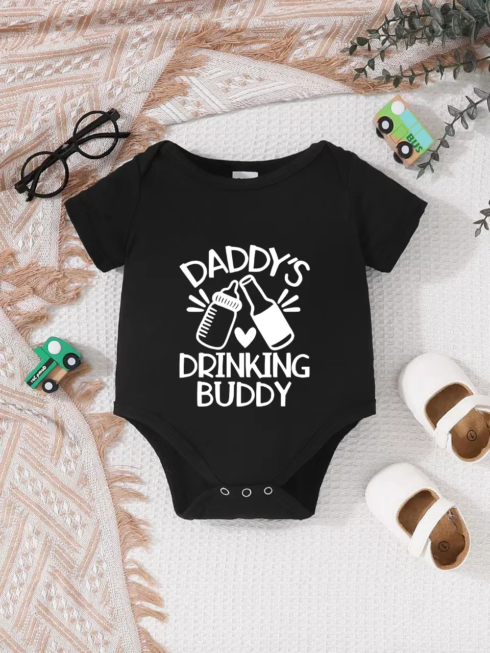 

Playful letter-printed baby short-sleeve triangle bodysuit. Button closure for easy dressing
