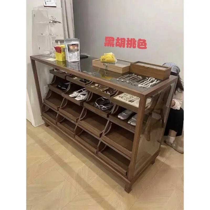 Children's clothing store island cabinet displays, clothing, shoes, glass island counters