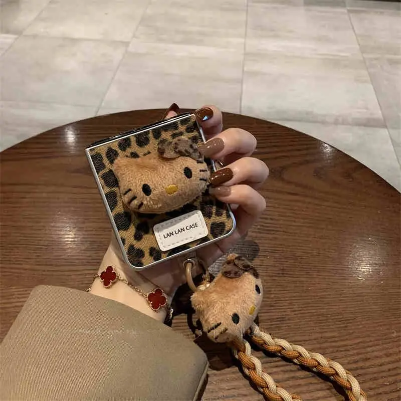 

Electroplated Leopard Print Hello Kitty Handheld Cord Phone Case for Samsung Galaxy Z Flip6 Flip5 Folding Screen Phone Case