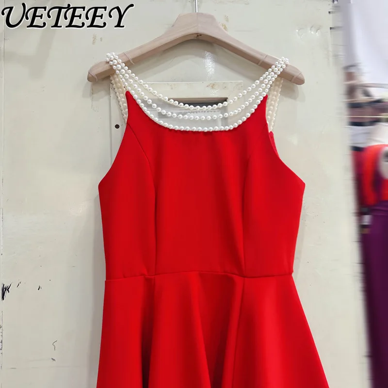 Europejska i amerykańska francuska gwiazda z temperamentem perłowa sukienka na szelkach letnie krótkie sukienki z wysokim stanem i odkrytymi plecami