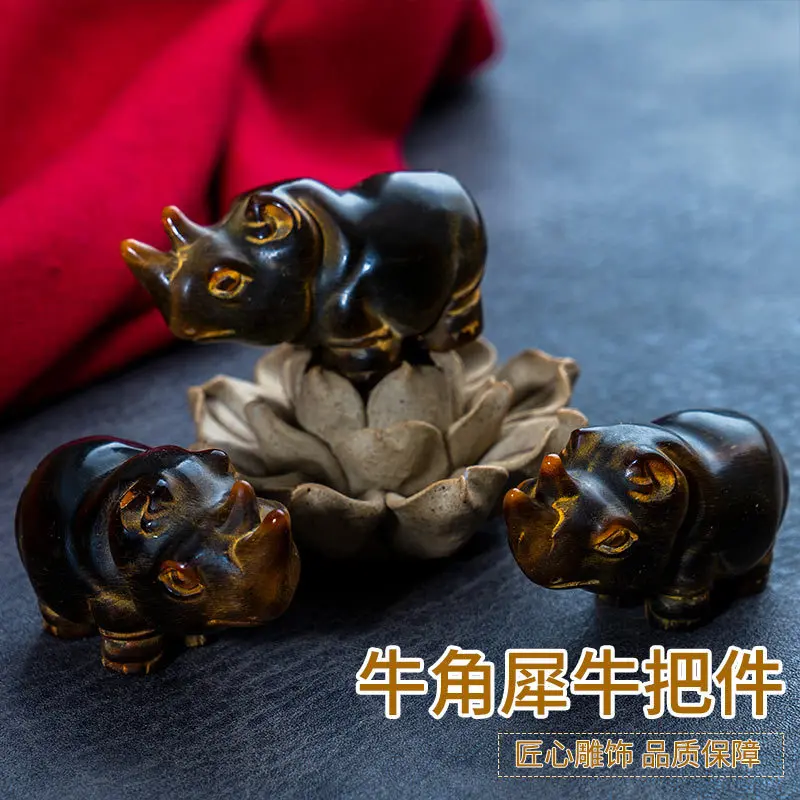 Carved handpiece with beautiful color and smooth grain black rhinoceros horn ornament