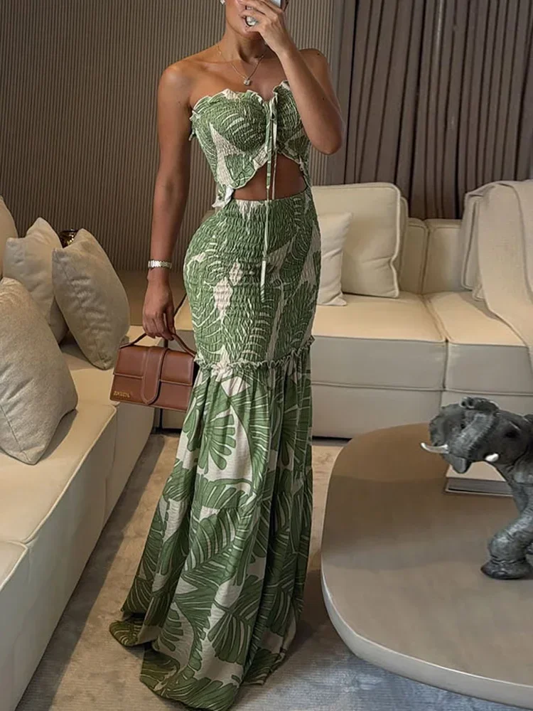 ชุดเดรสยาวพิมพ์ลายปาล์มเขตร้อนสำหรับผู้หญิง ชุดเดรสฤดูร้อนสำหรับวันหยุดพักผ่อน ชุดเดรสชายหาดแบบมีระบายและเว้าข้างสำหรับสาวๆ