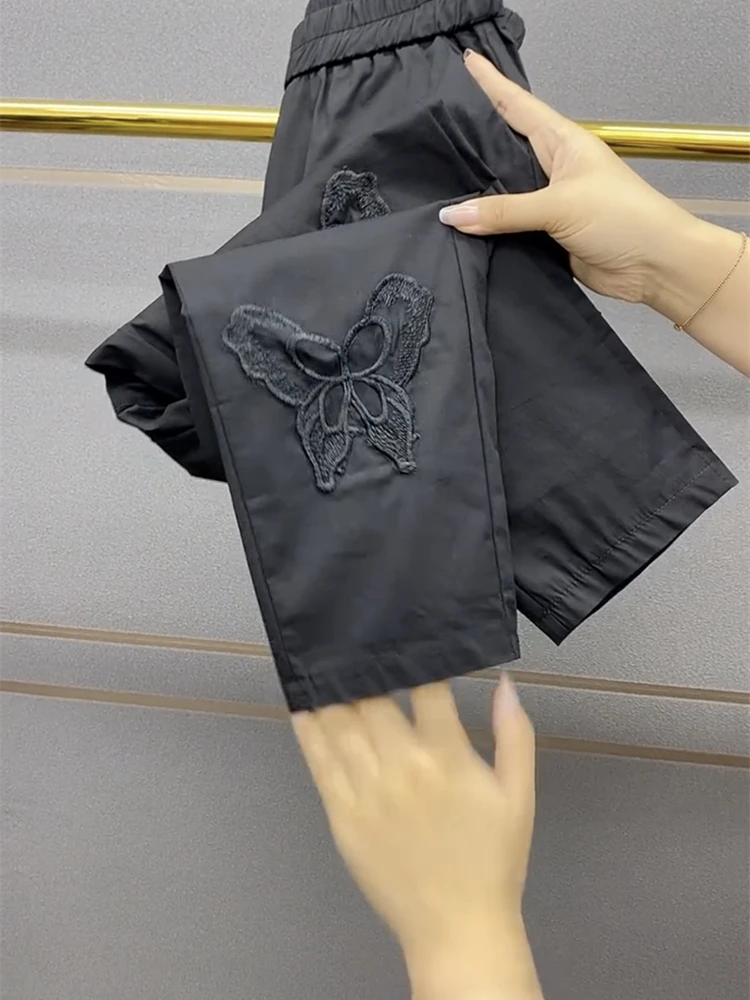 European Style Summer Thin Women's Paper facial mask Trousers Hollow out Butterfly Elastic Quick Drying Nine Cropped Pants