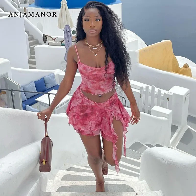 ANJAMANOR Conjunto de dos piezas sexy transparente de malla rosa, minifalda con volantes y top tipo camisola, trajes de vacaciones de verano para mujer, ropa de discoteca D17-CF23