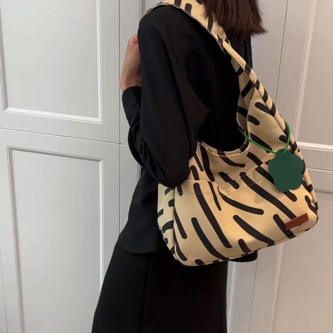 

Women Handbag Zebra Stripe Canvas Bag 2024 New Large Capacity Tote Bag Classroom Commuter Bag Simple and Versatile Shoulder Bag