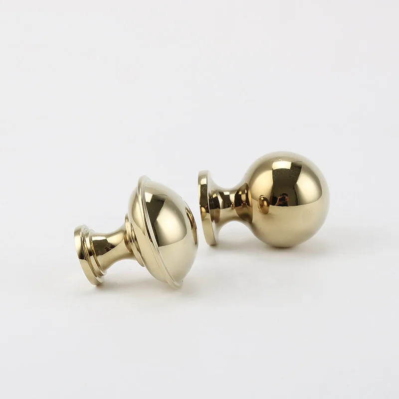 Gold knob bases and rounded tops in close view