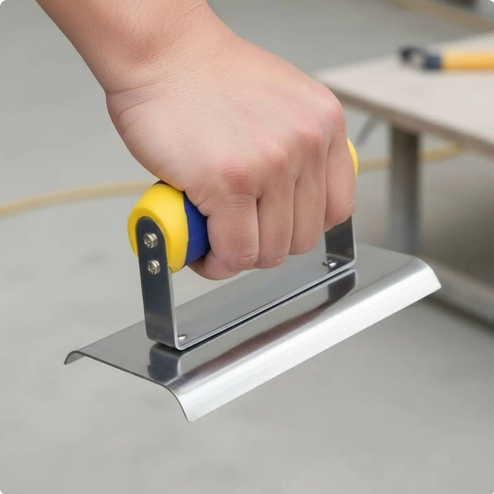 Stainless steel plaster smoother with ergonomic handle, drywall corner tool