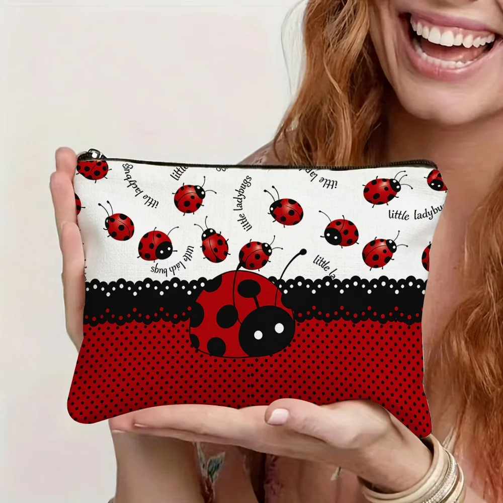 Ladybug printed cosmetic bag with sturdy zipper. Durable reusable canvas, ideal for frequent trips and storing delicate accessor
