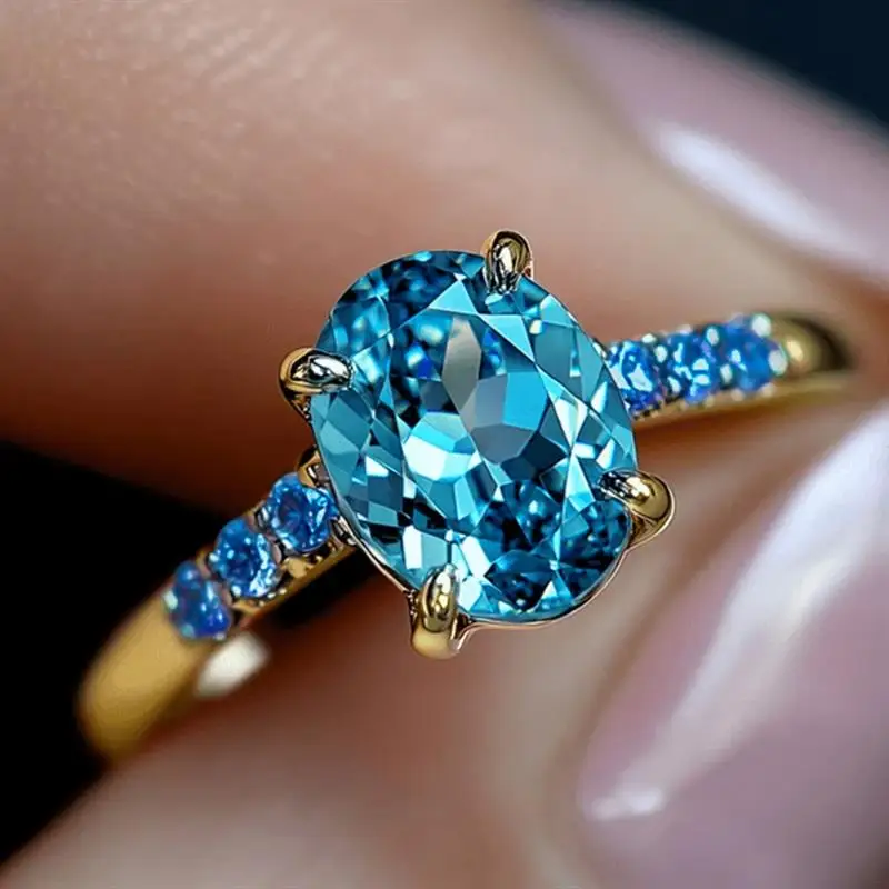 Huitan Damenring mit eingelegtem blauem CZ, modisches Hochzeits- und Party-Accessoire, goldfarben, vielseitig einsetzbar, für den Alltag, elegant, charmant, Schmuck, Geschenk