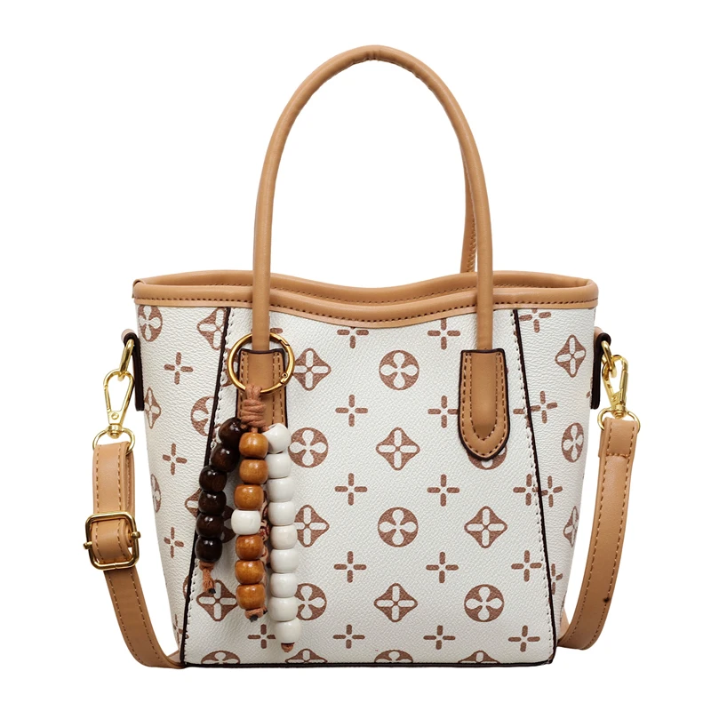 

Элегантная кожаная сумка для подгузников для женщин, дизайнерская сумка через плечо, минималистичный винтажный стиль с логотипом.