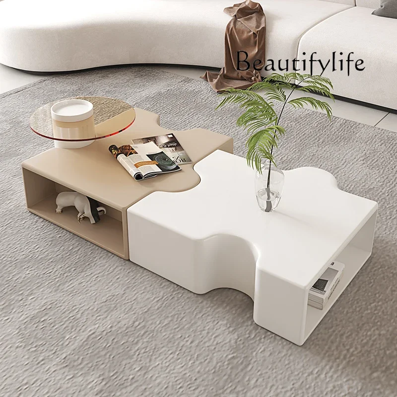 

New French light luxury designer creative white coffee table small apartment living room cream wind special shape