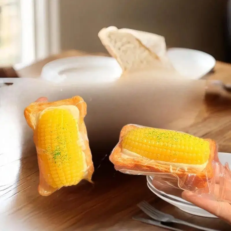 Brinquedos de pelúcia feitos à mão de tarta de ovo de milho de uma peça; Adereços de apertar para redução de estresse para jogos musicais infantis