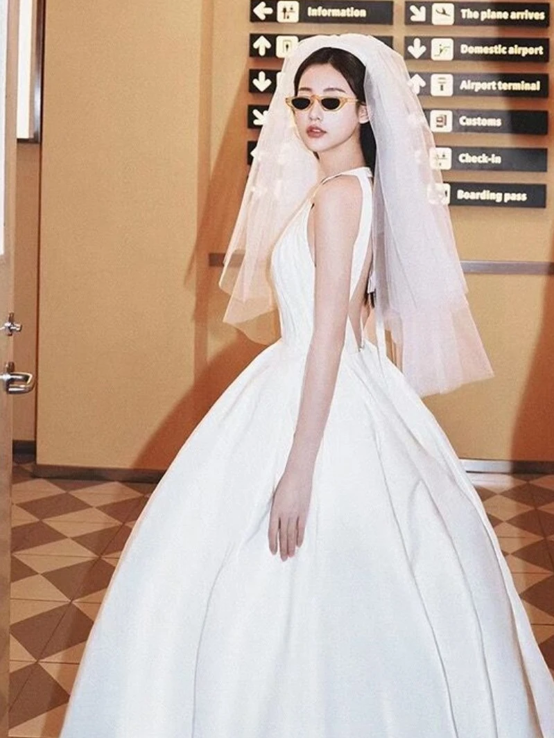 

Elegant Light Wedding Dress Neck Hanging Style Studio Photo Shoot Travel Photography White Bridal Veil Vintage Atmosphere