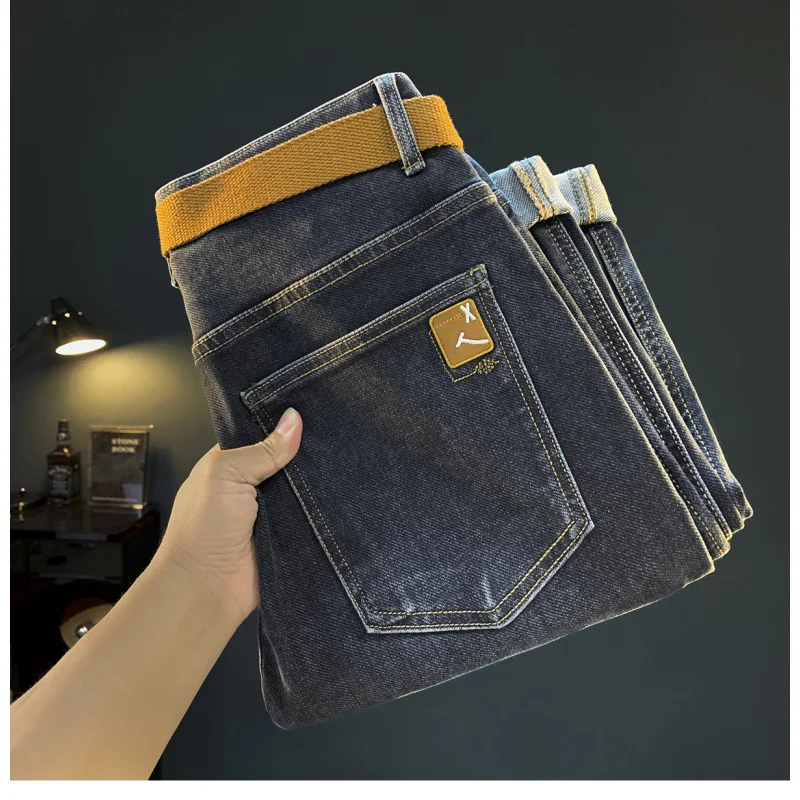 Primavera e outono novos jeans masculinos na moda versátil moda cinto estilo pequeno pé elástico casual haren tendência high-end