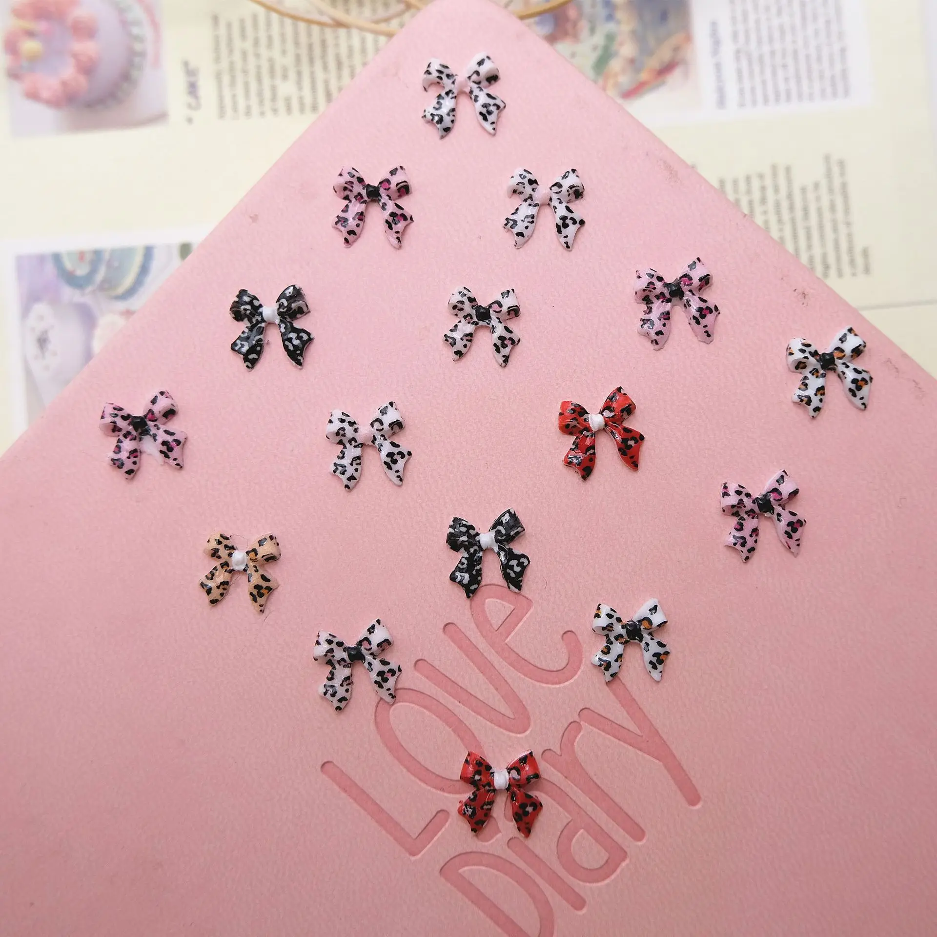 100Pcs Leopard Print Bow Tie Nail Charms - Flowing Ribbon Resin Nail Art, Fashionable Press-On Nail Decor for Stylish Manicures