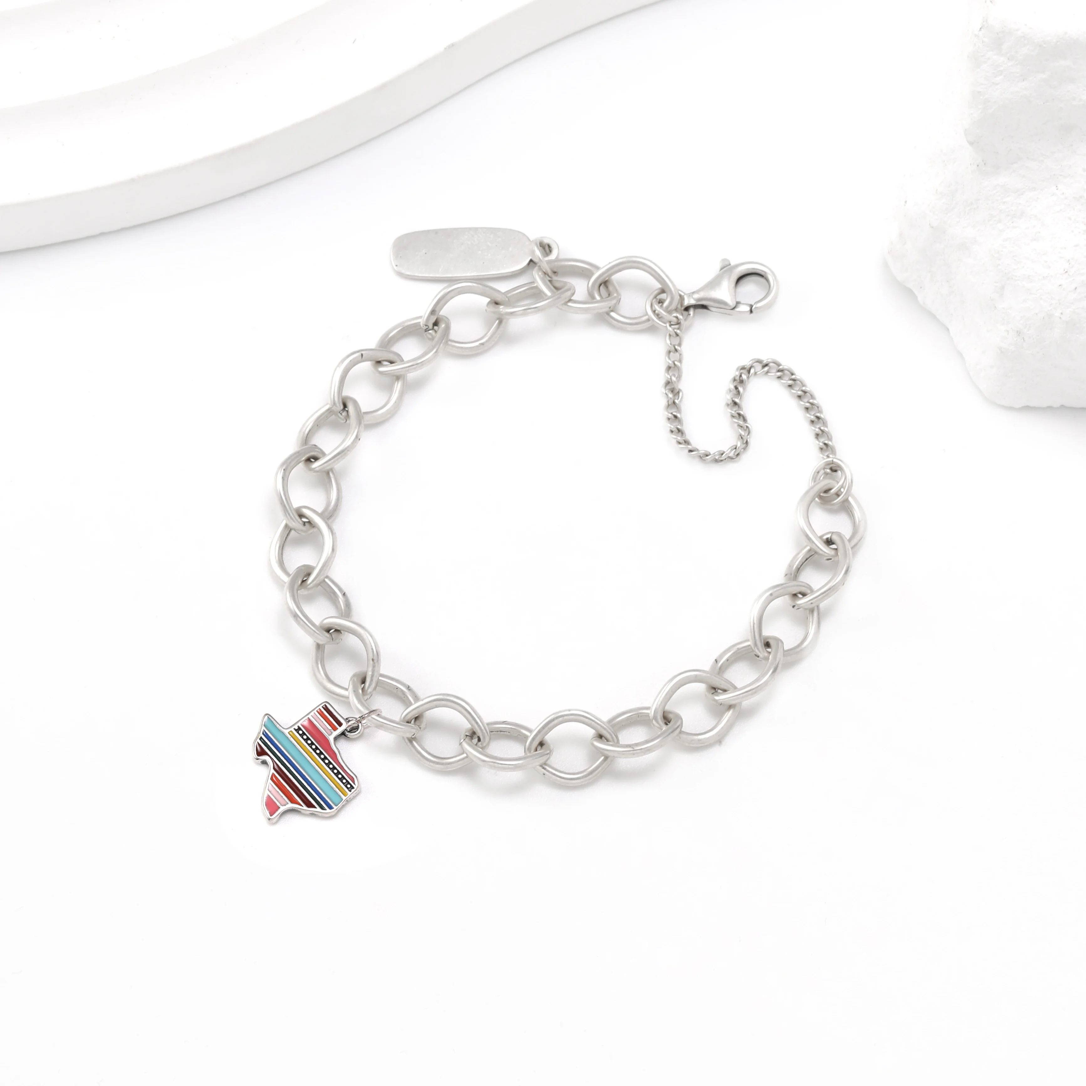 

Genuine 925 sterling silver Forged Link Charm Bracelet paired with colored enamel Texas pendant