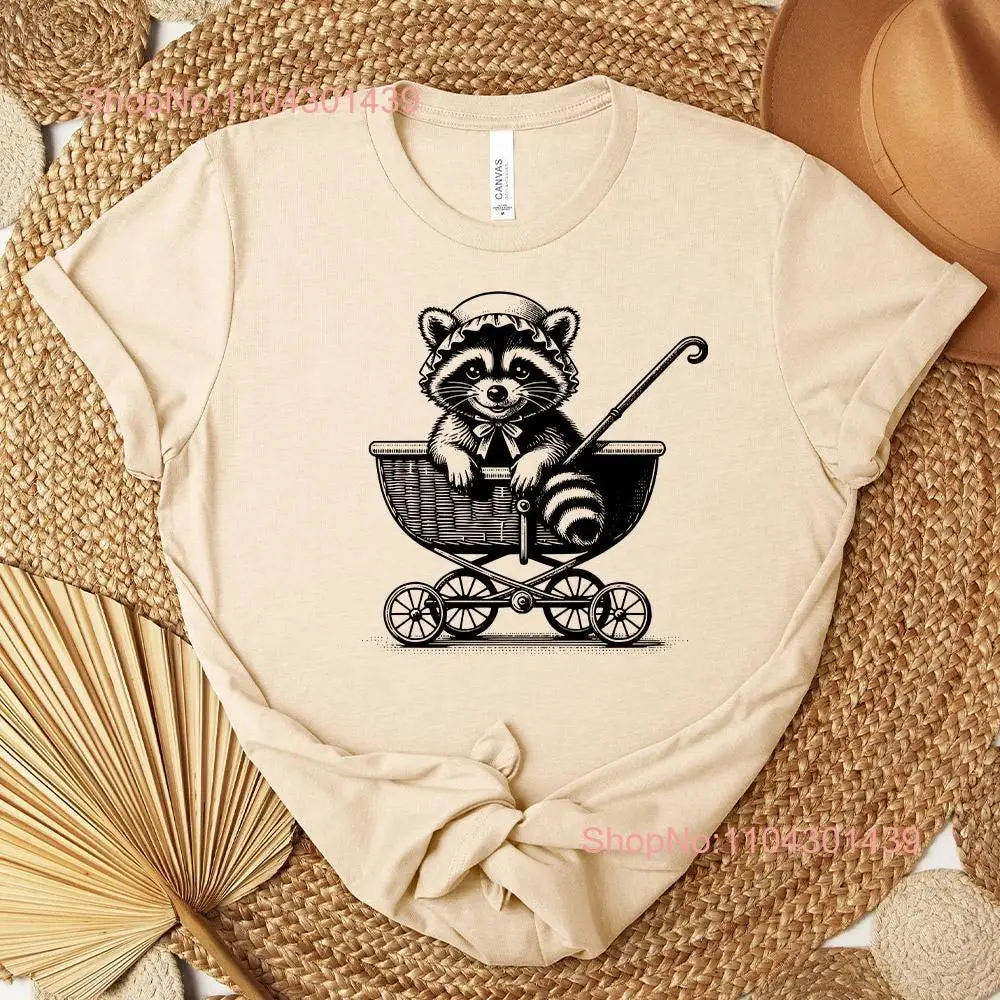 Cute Baby Raccoon Sitting in Pram Funny T Shirt for Animal Lovers Mom Fun Christmas long or short sleeves