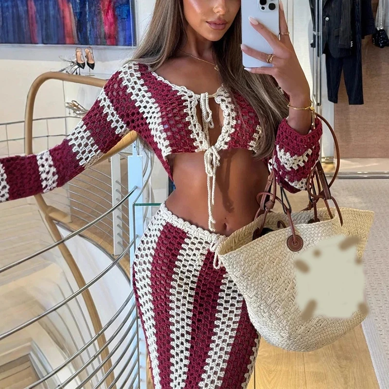

New sexy V-neck hollowed out striped contrasting knitted lace up long dress creates a beach vacation style two-piece set