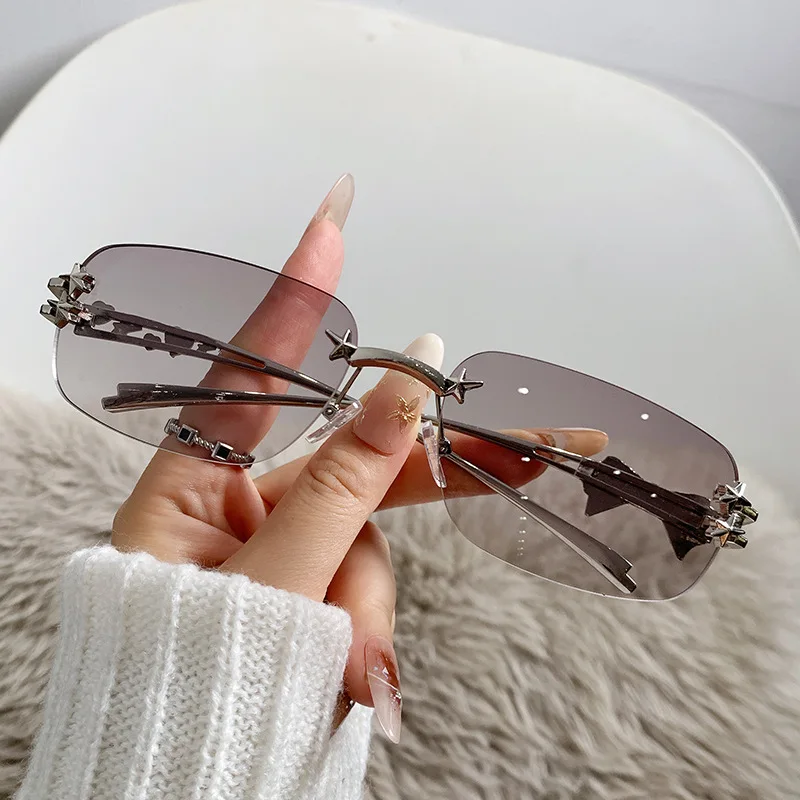 

Trendy new women's light colored sunglasses with fashionable cut edges and frameless metal sunglasses