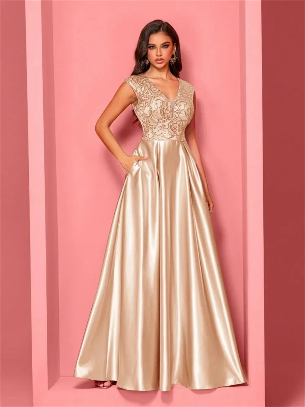

V-neck waist-cinching floor-length gown with elegant silhouette and flowing skirt. Customized to highlight your charm for a dazz