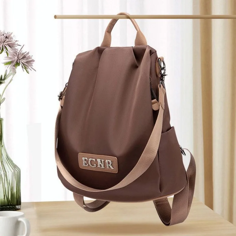 

Женская новая мода из ткани Оксфорд, повседневная школьная сумка, универсальный большой вместительный женский уличный дорожный рюкзак, водоотталкивающая сумка