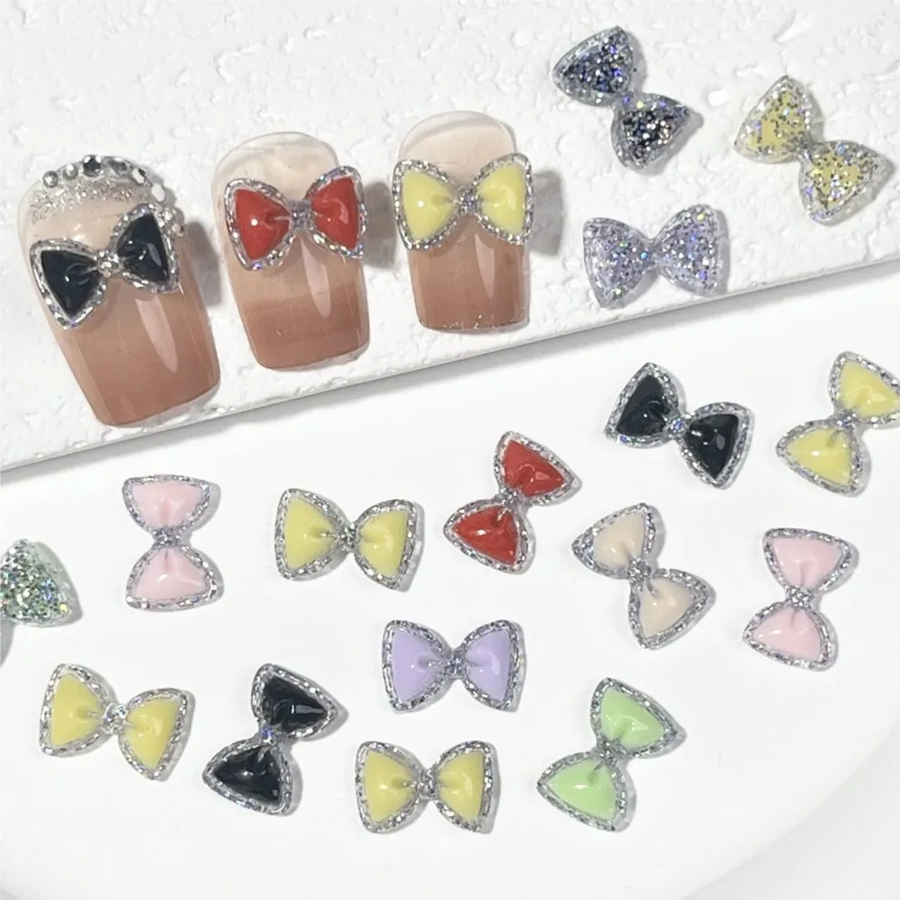 50 個発光カラフルなグリッターちょう結びネイルラインストーンスパークリングボウ樹脂ネイルチャーム 12*7 ミリメートルフラットバックボウタイネイル用品 E3