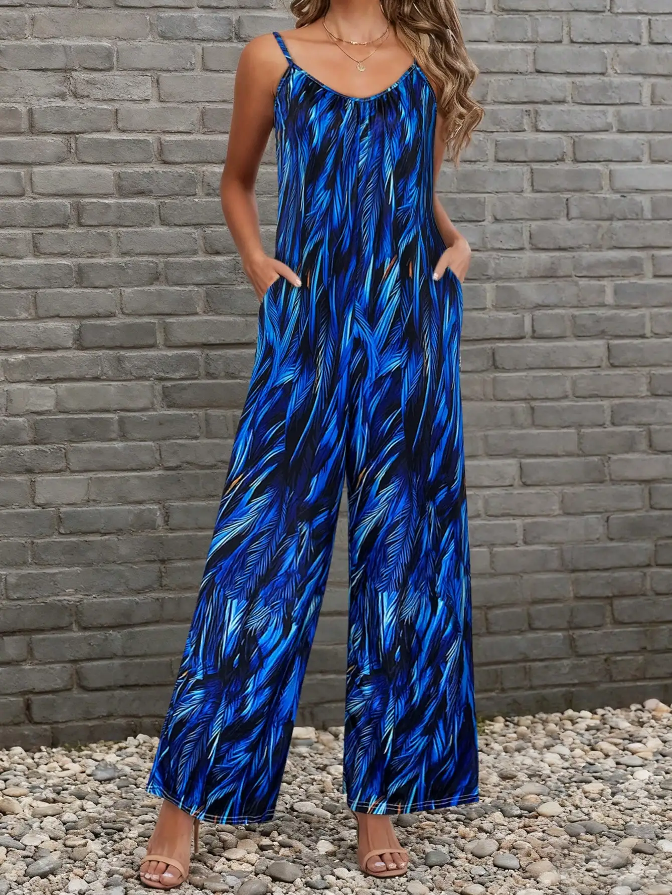 Mono de mujer azul real con estampado de plumas y hojas, tirantes finos, pierna ancha, cuello en V, sin mangas, holgado, informal