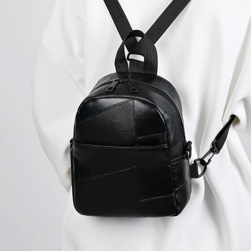 Zaini in materiale PU da uomo e da donna in stile neutro per viaggiare e fare shopping. Può essere indossato come una borsa a tracolla singola.