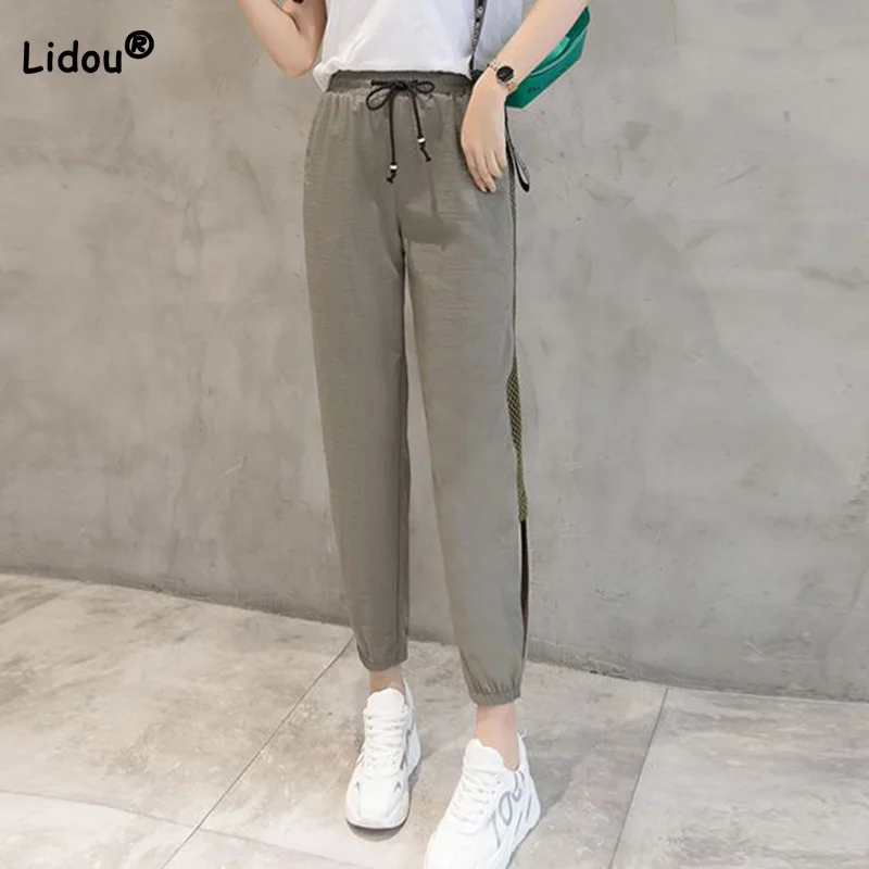 2023 Summer New Thin Mesh Hollow Out Harem Pants Women Loose Solid Color Drawstring Pockets Leisure Time Cropped Sports Trousers