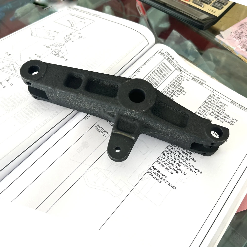 BROTHER RH9820 Ojal electrónico botón Holer máquina de coser piezas cortador ARM Assy SA 6787001