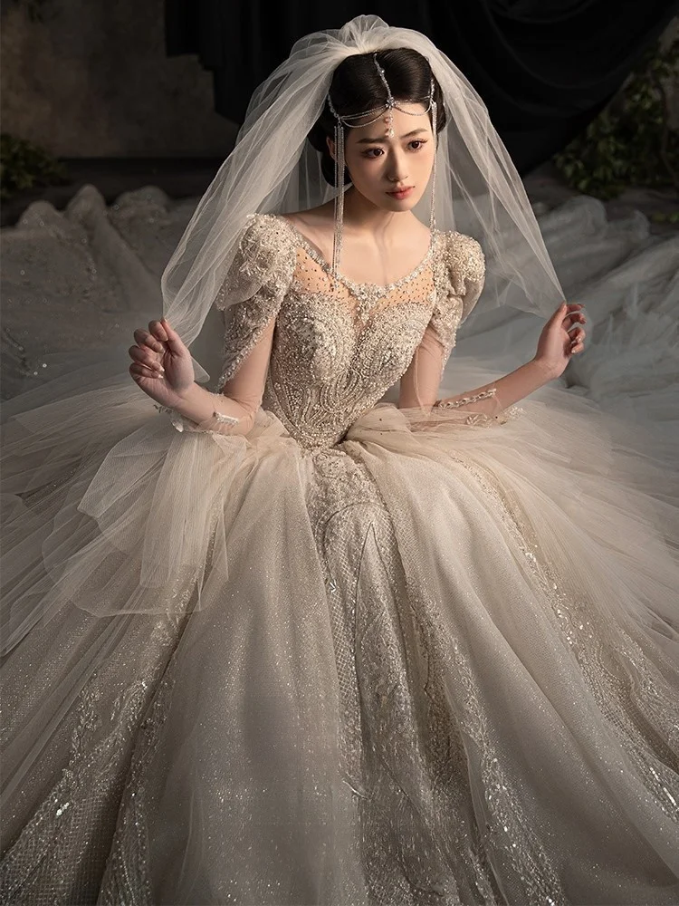 

A new super heavy-duty long-sleeved dress with textured main fabric and large tail