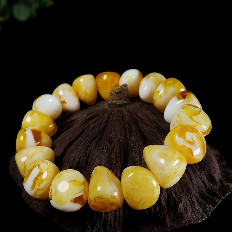 bracelet with honey-colored and white floral amber beads