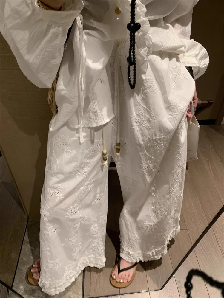 Białe koronkowe spodnie z szerokimi nogawkami, elastyczną talią, luźne, codzienne, o prostym kroju, letnie, nowe, wyszczuplające, damskie, modne.