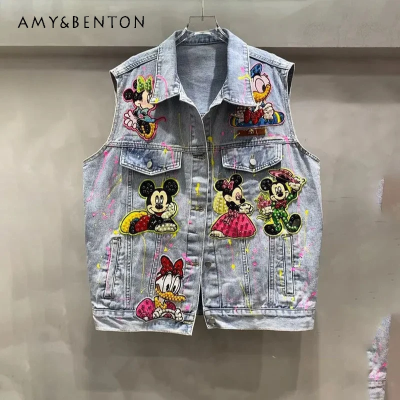 Kamizelka w stylu commuter z koralikami, cekinami i graffiti, kurtka dżinsowa o średniej długości w stylu heavy industry, wiosna-jesień 2026, kamizelka Y2k z motywem kreskówkowym.