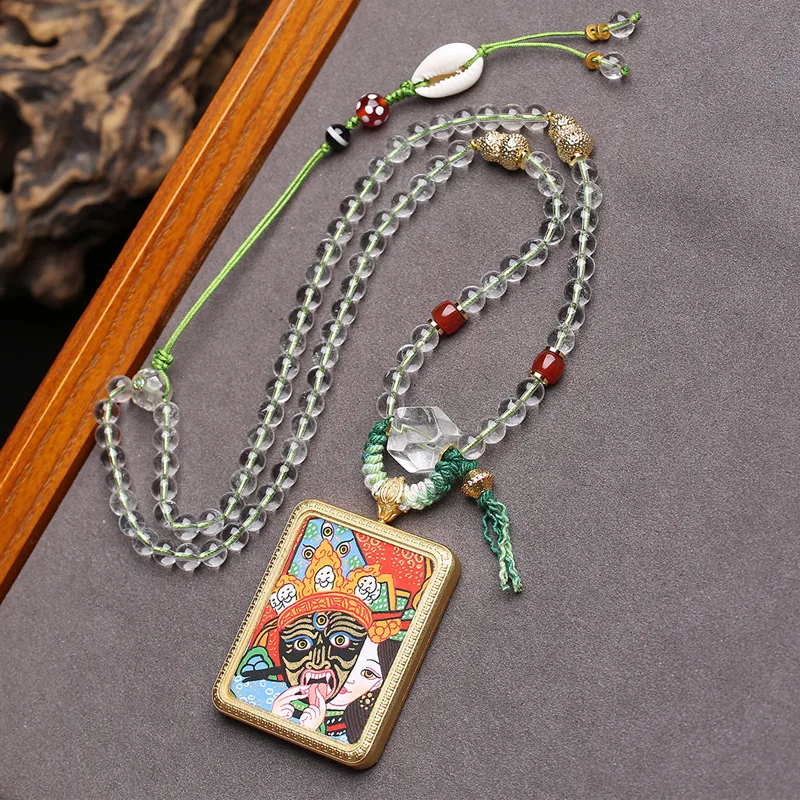 

Hand-painted Thangka amulet pendant depicting the past and present lives of Zaki Ram,with agate,shell and white crystal necklace