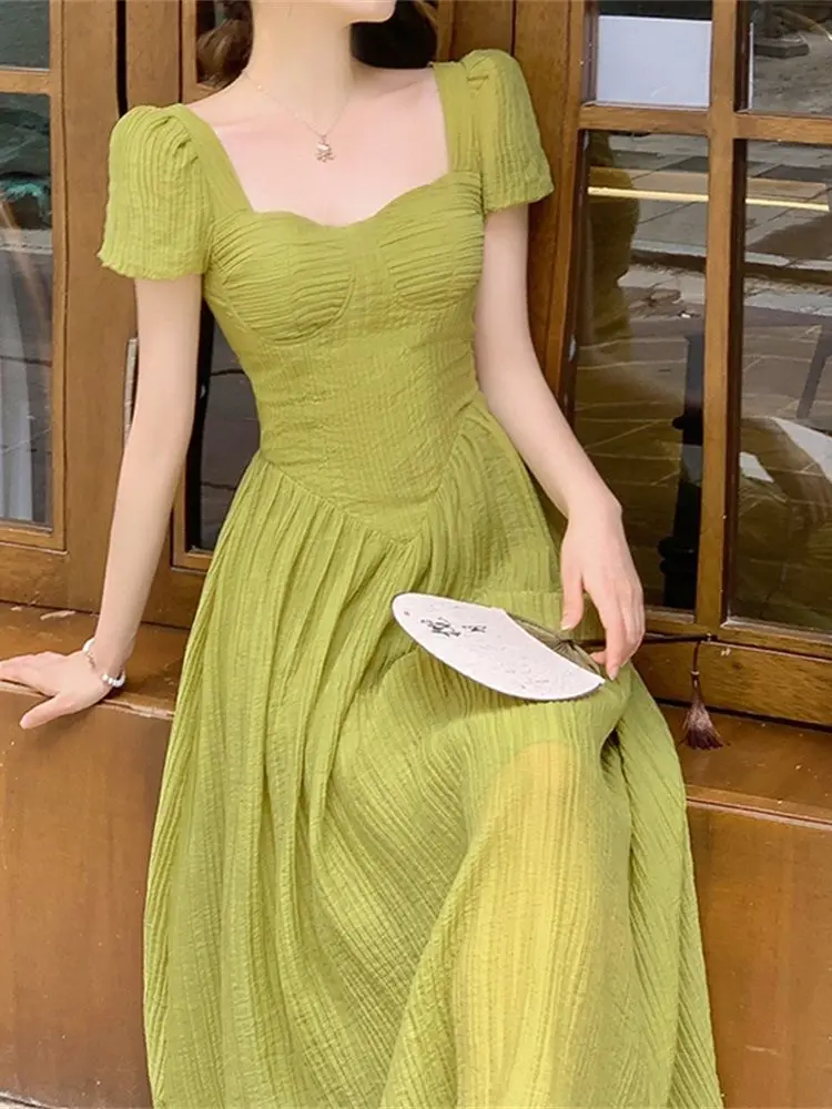 

French style small fragrant design long skirt with a slimming waist, exuding a fairy like green dress for summer