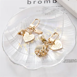 Gold color keychains for women and girls, keychains, jewelry, accessories, pearl, shell, heart, letter, beautiful, car, bag 10 Main Sales Keychain Lyrics - №10