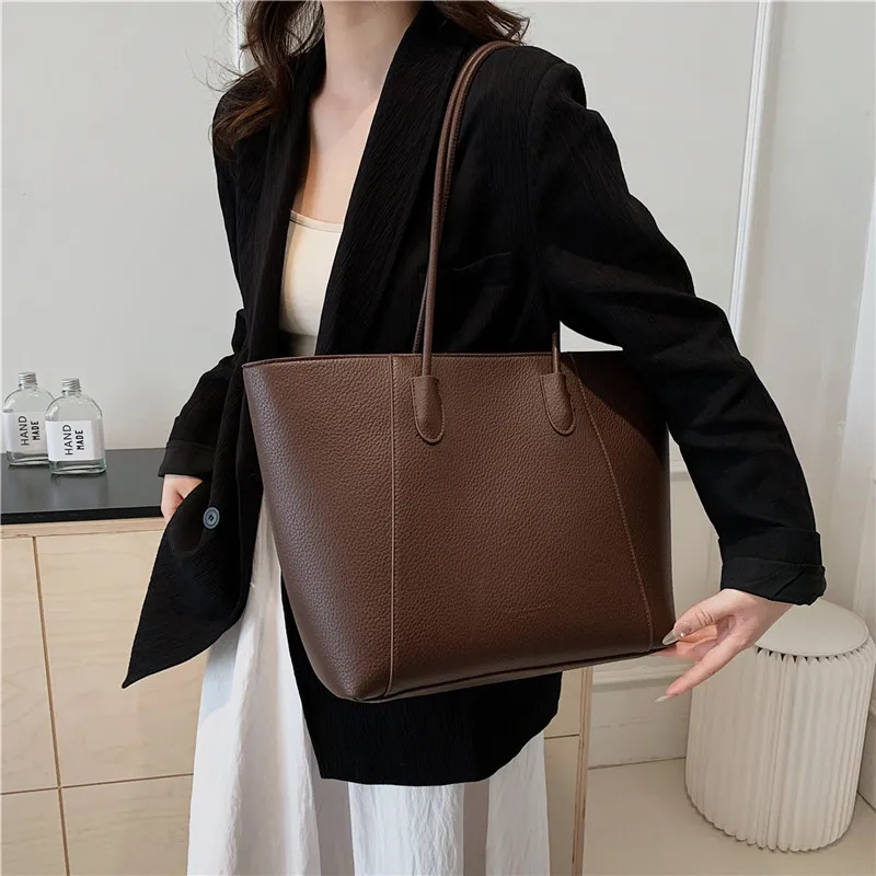 

Large capacity soft surface retro bucket bag 2025 new pure color fashion leisure commuting simple shoulder Tote bags