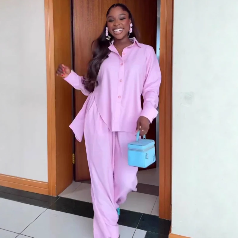 

Новый африканский модный женский комплект из двух предметов розового цвета, рубашка с нерегулярным разрезом на талии, комплект из топа и брюк