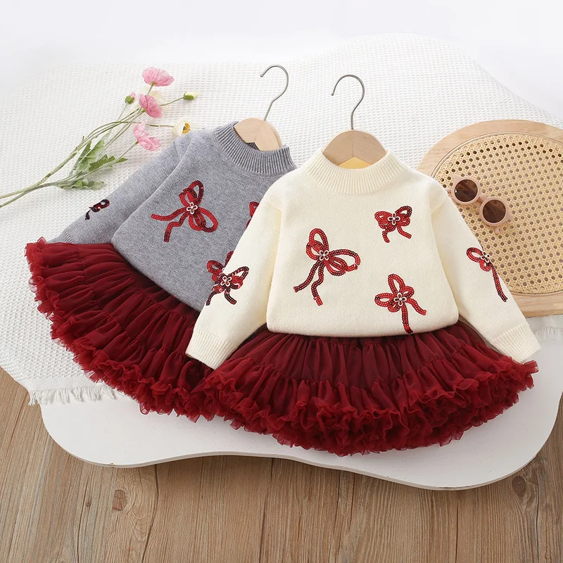 

New autumn and winter girls' knitted suit with red bow knit top and pleated skirt two-piece set for children's Christmas clothin