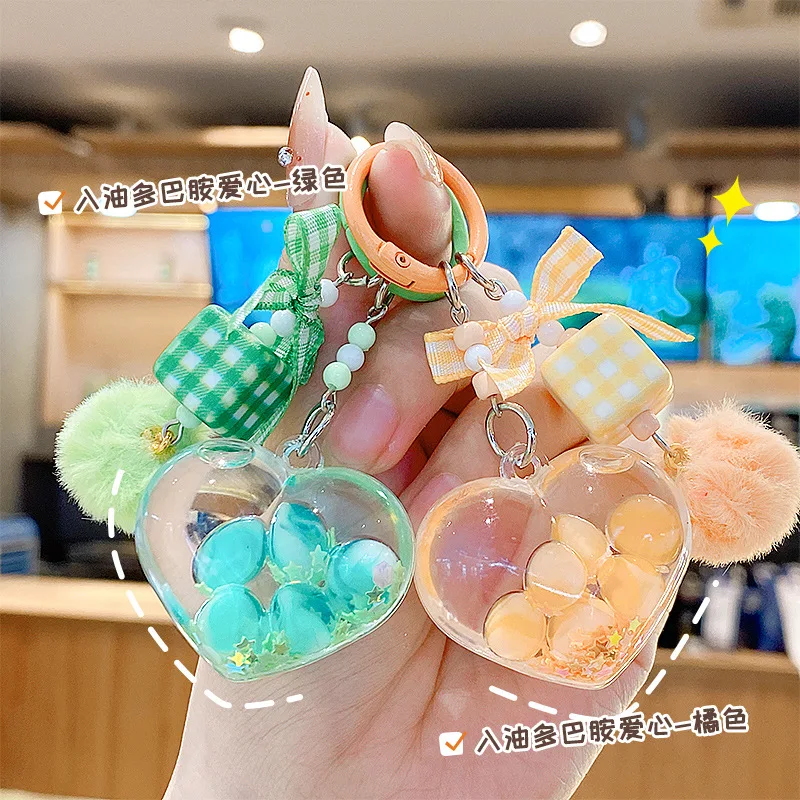 Llavero con forma de corazón líquido colorido, con letras de arena movediza flotante y grageas de azúcar, accesorios colgantes para parejas y amigos