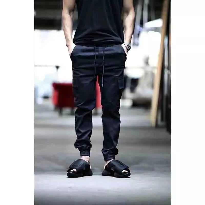 Men's new solid color lace up three-dimensional pocket closing foot trend casual pants small leg pants hip hop Street large