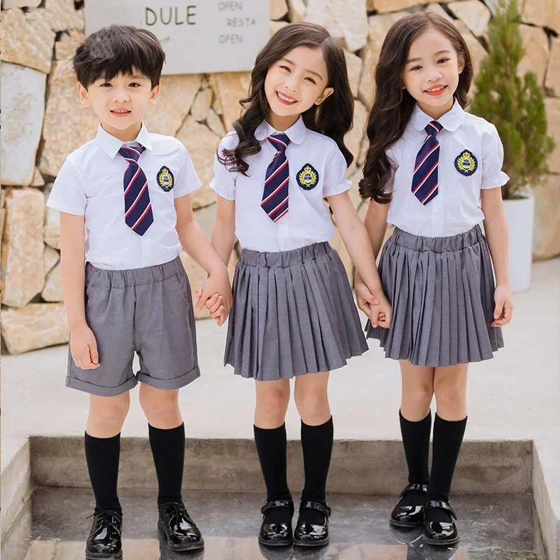 Bambini uniforme scolastica coreana ragazzi ragazze gonna a pieghe gilet Top abbigliamento da prestazione per bambini Set abbigliamento da palcoscenico uniforme per studenti